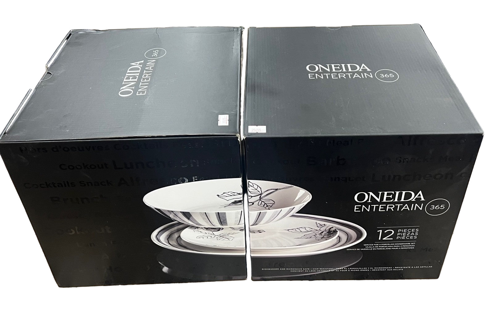 Two black boxes with Oneida Entertain branding on a stone surface