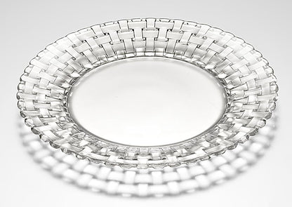 Clear glass plate with woven design on a light gray background