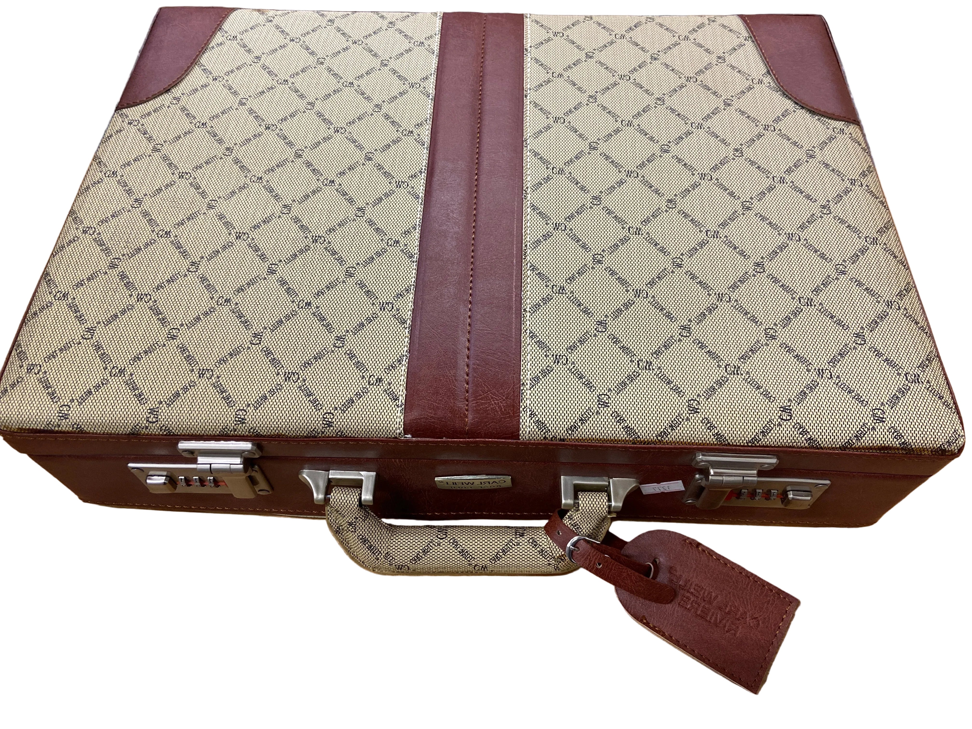 Vintage-style suitcase with diamond pattern and brown leather straps on a white surface.